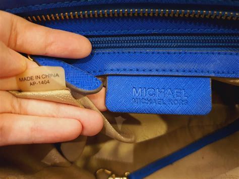 how to tell is a michael kors bag is real|Michael Kors authentication serial number.